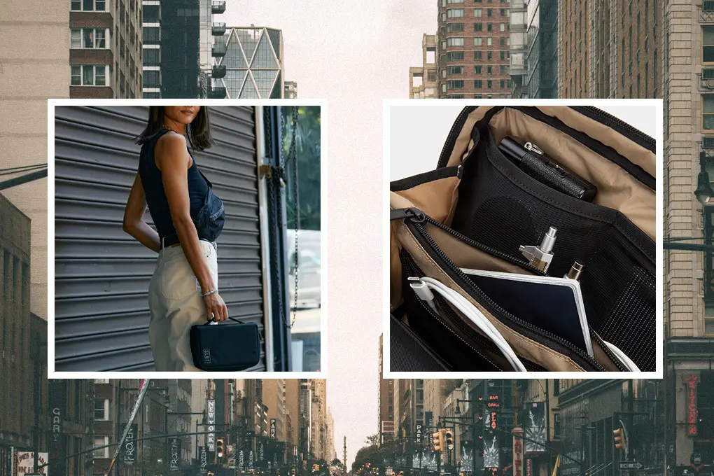 A woman holds a black bag while standing in front of a building with a city backdrop, showing its compartmentalized and well-organized interio