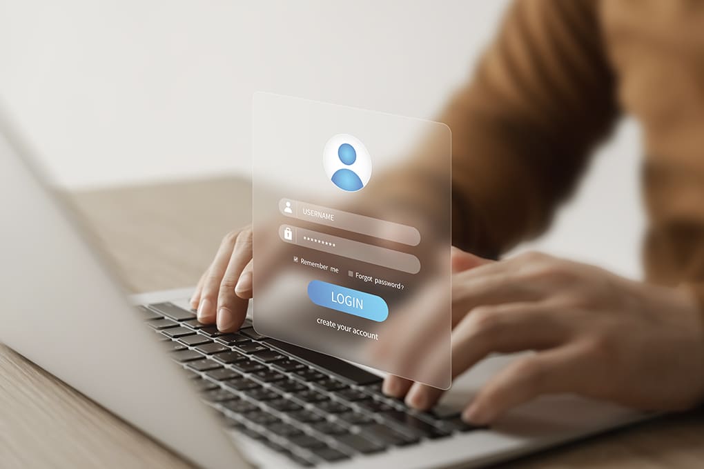 A man with a laptop wants to log in to a website and clean up his personal data